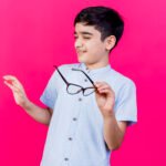 Dr. Ramesh Murthy examining a child's eyes at Axis Eye Clinic